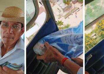 El párroco antes de lanzar los billetes y regalos